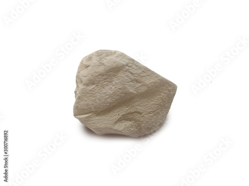 Talc isolated on white background. Talc is a clay mineral composed of hydrated magnesium silicate. There is noise and grain caused by the texture of the stone.