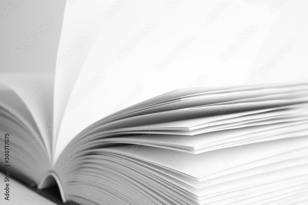 Closeup view of open book on white background Closeup view of open book on white background