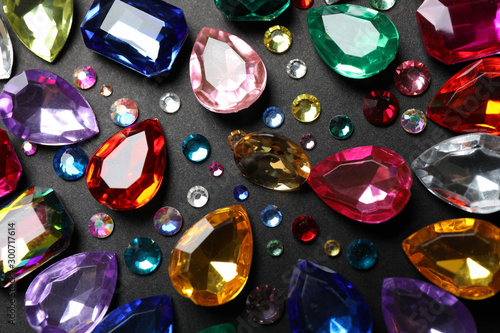 Flat lay composition with beautiful gemstones on dark background