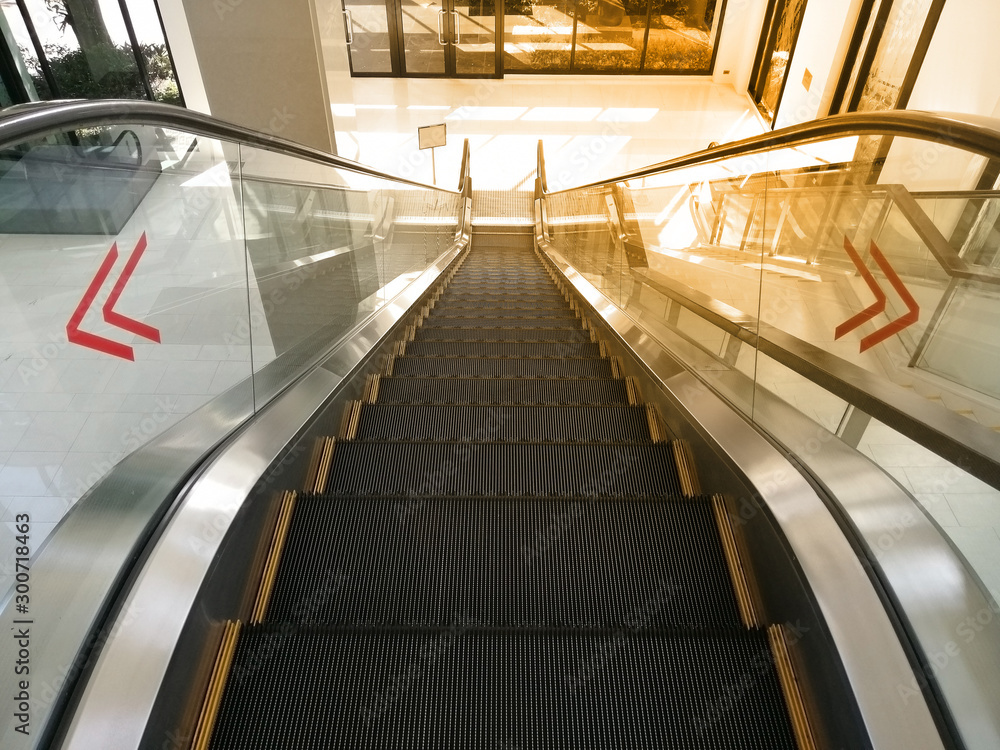 Fototapeta premium Escalators in an office building.