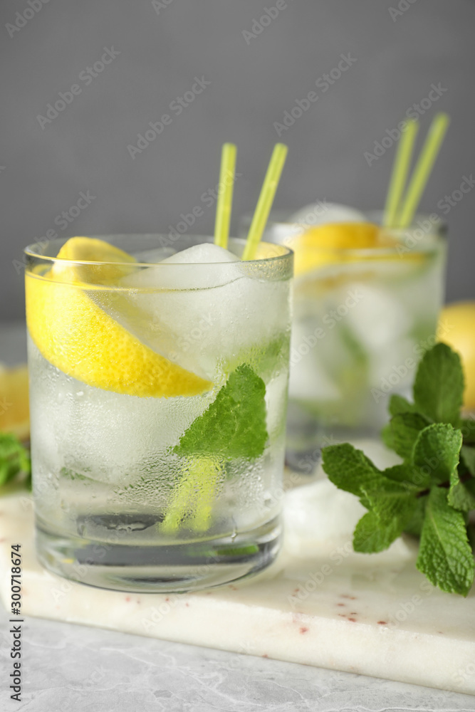 Fototapeta premium Cocktail with vodka and lemon on marble table