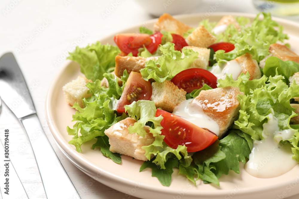 Delicious fresh Caesar salad on plate, closeup Delicious fresh Caesar salad on plate, closeup