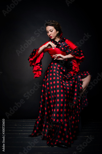 Canvastavla Carmen beautiful woman in red dress on dark background