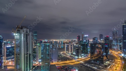 Wallpaper Mural Aerial view of illuminated buildings timelapse during all night and high traffic on roads near canal. Night life in Business Bay, Dubai, United Arab Emirates Torontodigital.ca