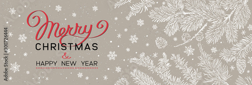 Christmas banner with branches of christmas tree on brown. Happy new year greeting.