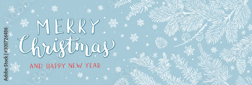 Christmas banner with branches of christmas tree on blue. Happy new year greeting.