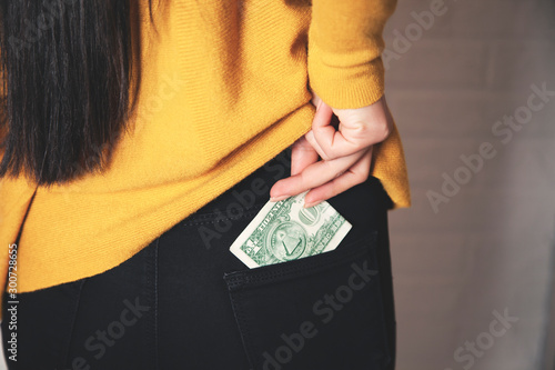 Tablou pe pânză woman hand money on pocket