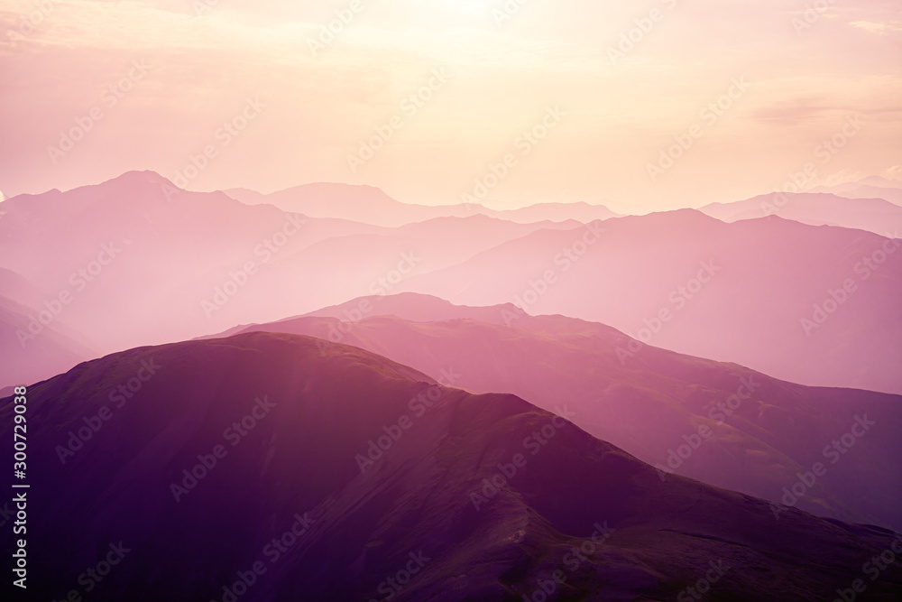 Pink sunset in the mountains. - obrazy, fototapety, plakaty 
