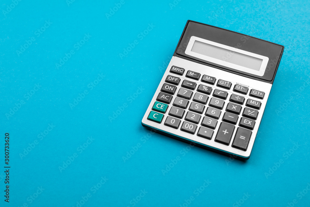 Calculator and magnifying glass on blue background. Calculator and magnifying glass on blue background.
