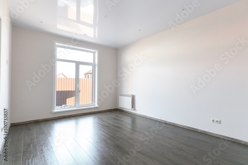 unfurnished house or apartment in bright colors with a dark floor