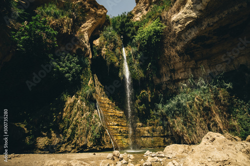 david waterfall ein gedi is an oasis and a nature reserve in Israel, located west of the Dead Sea, near Masada and the Qumran Caves photo