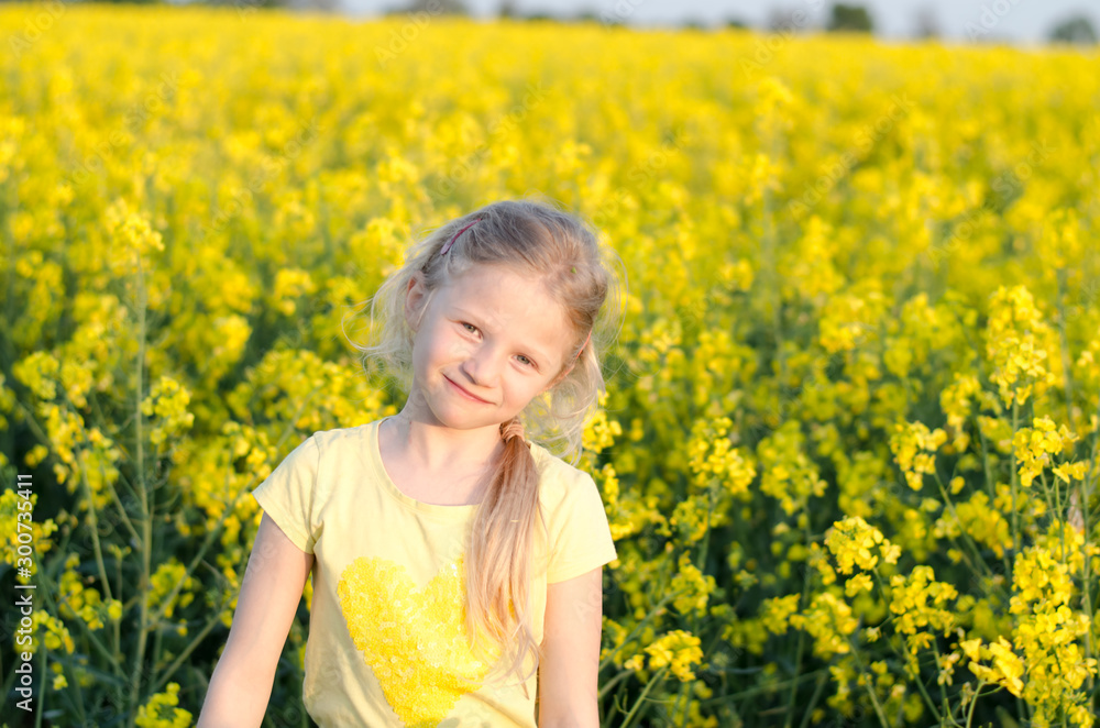 charming blond girl relaxing in yellow meadow charming blond girl relaxing in yellow meadow