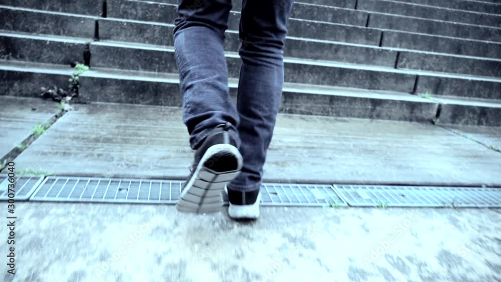 Reaching the top. Running up on stairs Reaching the top. Running up on stairs