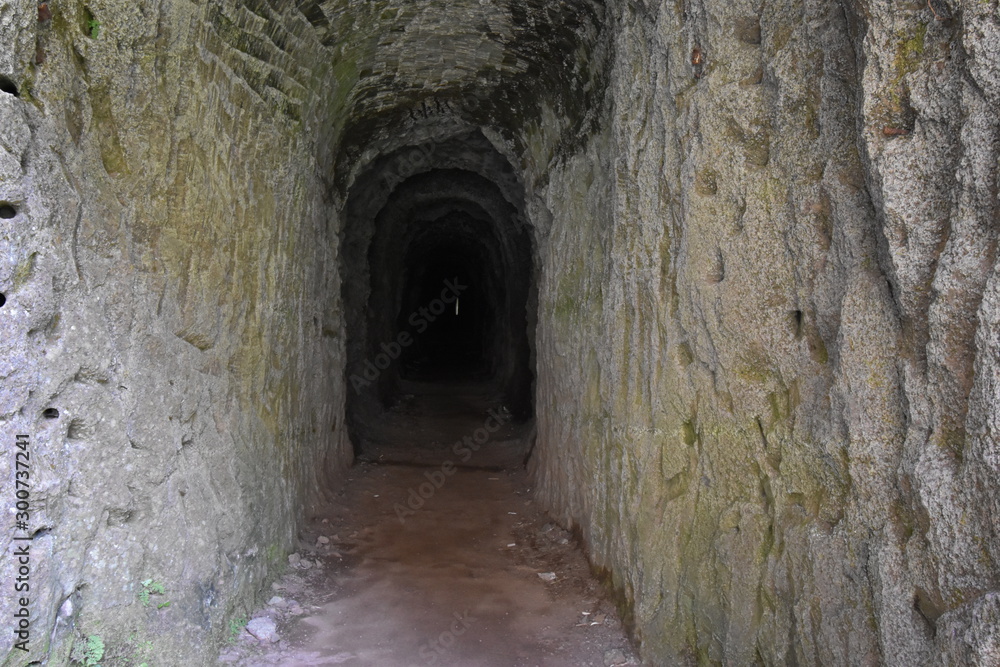 Obraz premium A tunnel at the hiking trail from Pico Arieiro to Pico Ruivo in Madeira, Portugal