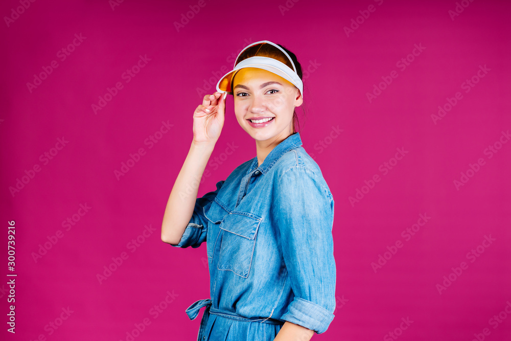 studio pink. visor girl with an open look and a wide smile
