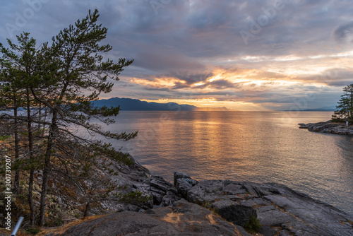 Ocean sunset over mountains in beautiful British Columbia. Canada. © karamysh
