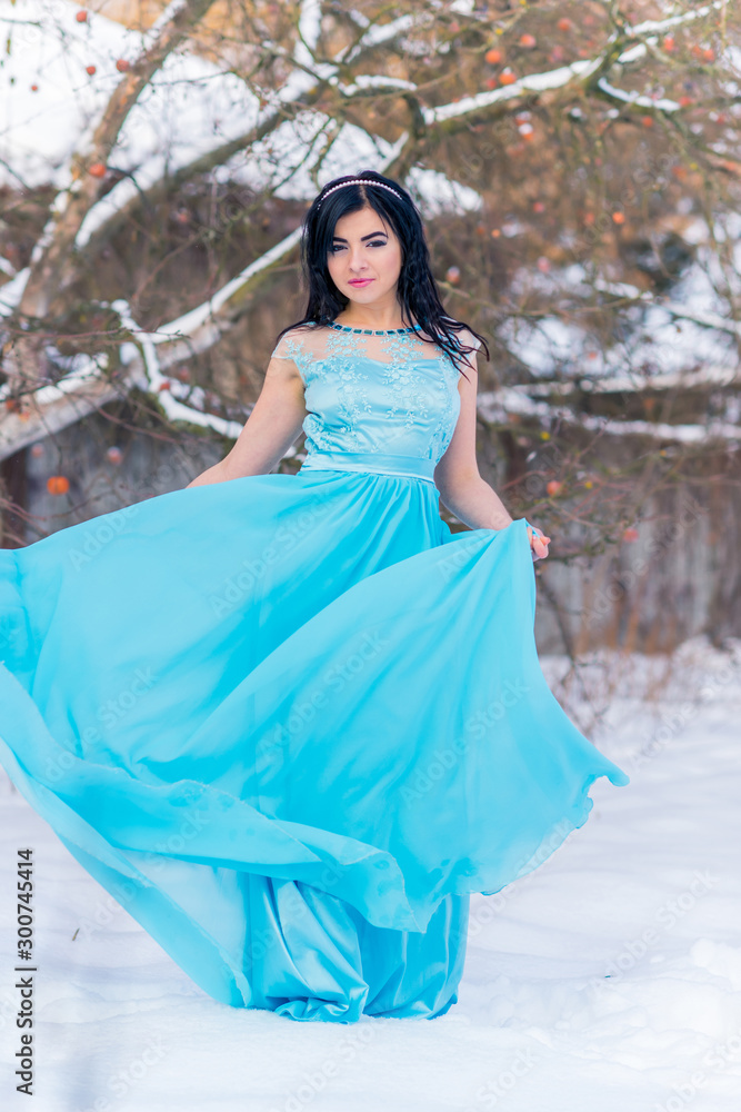 Christmas or New Year Holidays, magical atmosphere and pretty woman at snowy day. Inspiration and winter idea Christmas or New Year Holidays, magical atmosphere and pretty woman at snowy day. Inspiration and winter idea