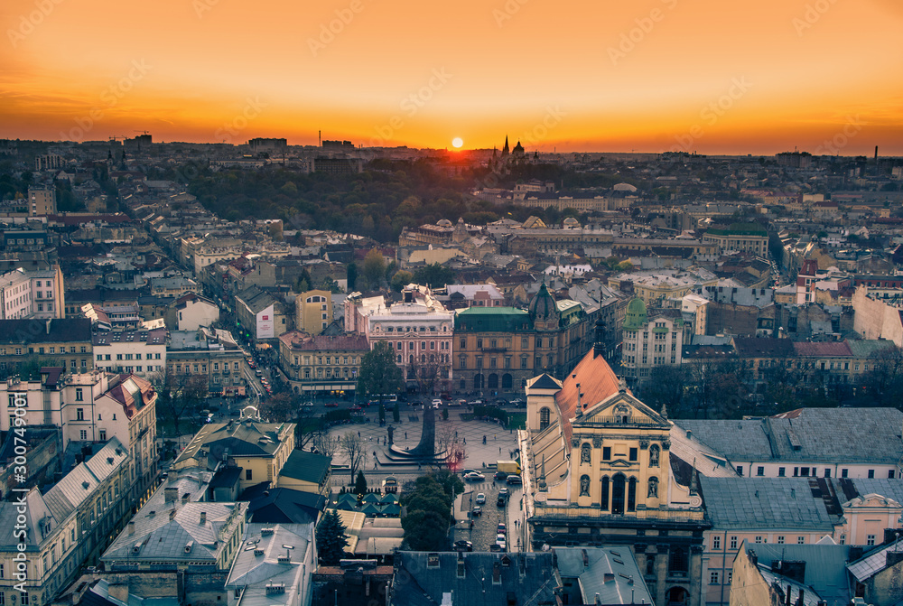 Lviv, Ukraine - October 24, 2019: Lviv old city panorama. Outstanding sunset over the roofs and historical streets. Main square