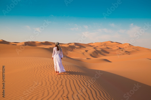 UAE. Woman in desert