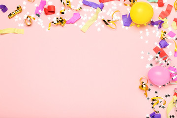 Colorful ribbons with balloons and stars on pink background