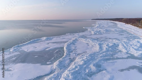 Wallpaper Mural Flying low ove frozen sea shore in winter - aerial drone shot Torontodigital.ca