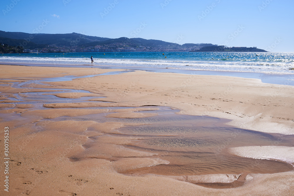 Empty beach with low tide in Playa America near Vigo, Galicia
