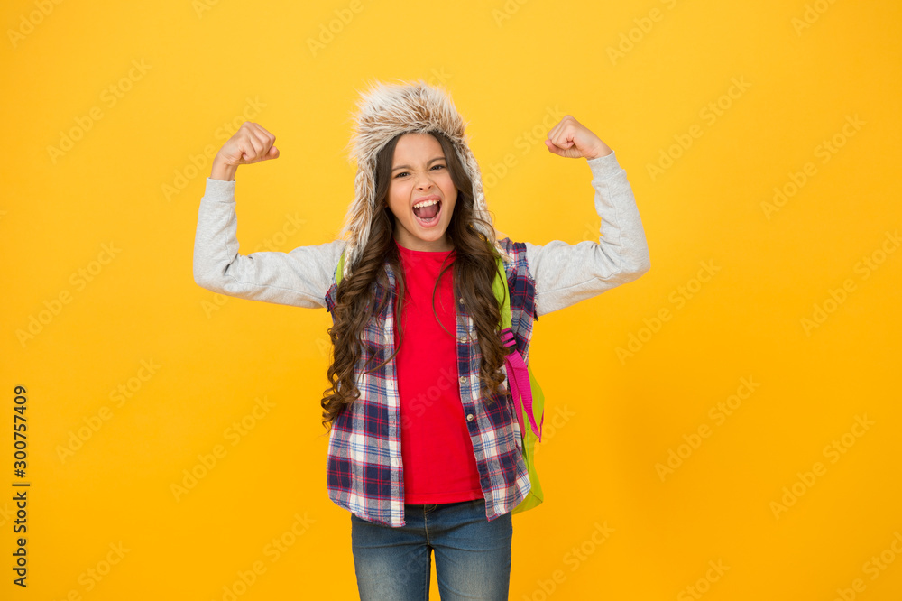 Powerful. Winter events at school. Winter entertainment and activities. Child schoolgirl long hair soft hat enjoy season. Winter season concept. Kid girl wear hat with ear flaps. Winter vacations Powerful. Winter events at school. Winter entertainment and activities. Child schoolgirl long hair soft hat enjoy season. Winter season concept. Kid girl wear hat with ear flaps. Winter vacations