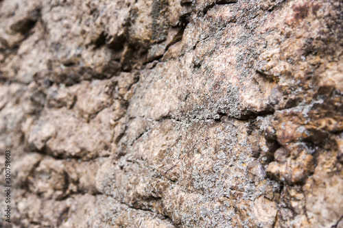 Cliff surface close-up. Uneven stone surface, beautiful background. Rock formation, texture. Macro.