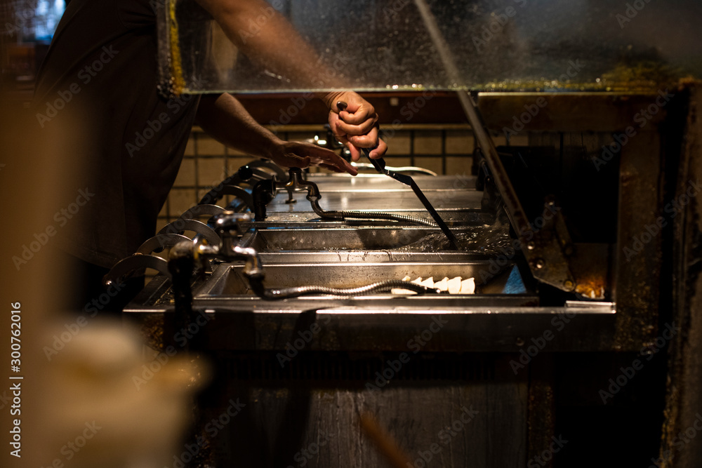 Chef cooking gyozas in a restaurant in Tokyo, Japan Chef cooking gyozas in a restaurant in Tokyo, Japan