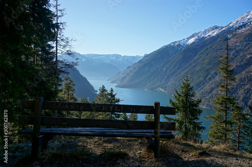 bench overlooking a lake in the mountains