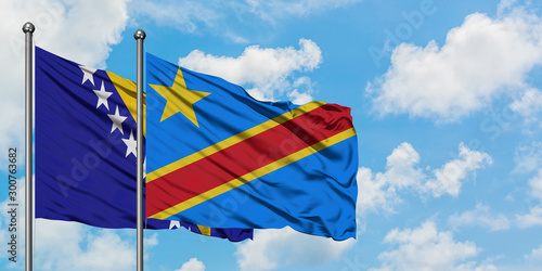 Bosnia Herzegovina and Congo flag waving in the wind against white cloudy blue sky together. Diplomacy concept, international relations.