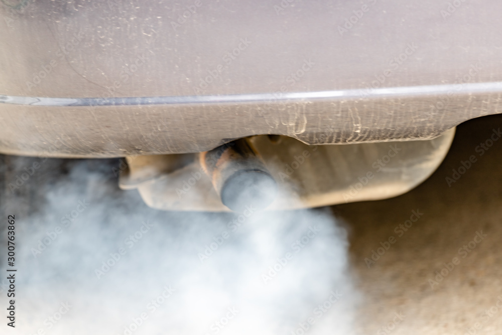 Car exhaust pipe coming out of the diesel exhaust. Concept: transport or health protection