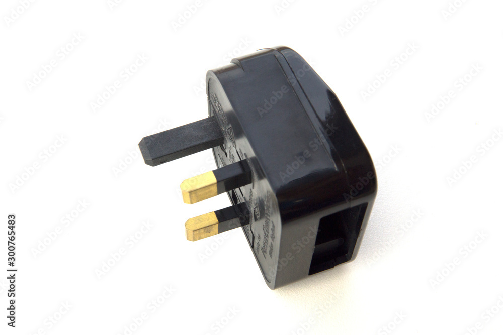 Black fused electrical adapter on white background. Black fused electrical adapter on white background.