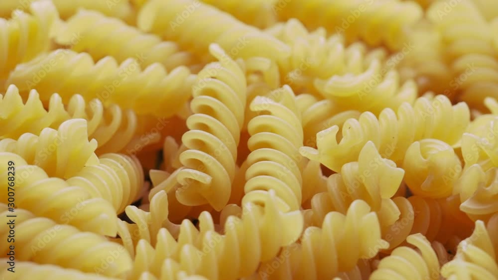 Close up of raw Italian fusilli pasta rotating in circle UNGRADED Close up of raw Italian fusilli pasta rotating in circle UNGRADED