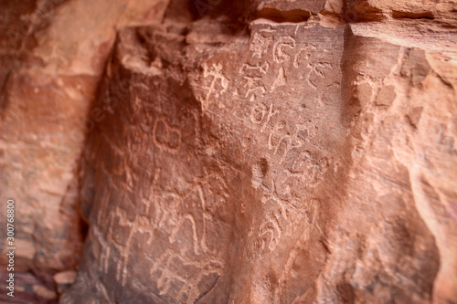 Khazali canyon rock carvings - Petroglyphs and ancient scripts (Thamudic, Nabatean, Arabic) illustrating the 12000 years of human occupation in Wadi Rum, Jordan