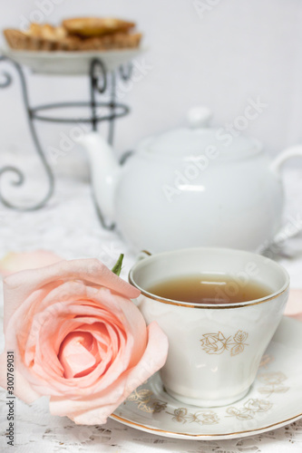 tea time with rose flower and dessert