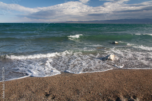 Cloudy sunset on a mountain lake. Mongolia