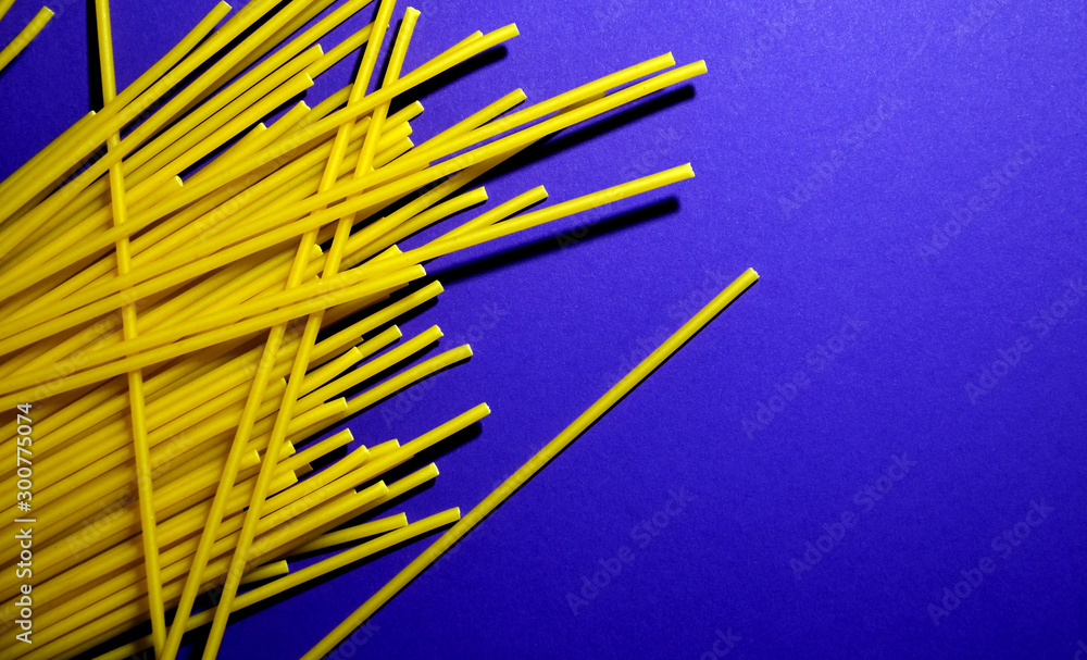 Raw pasta on a blue background Raw pasta on a blue background