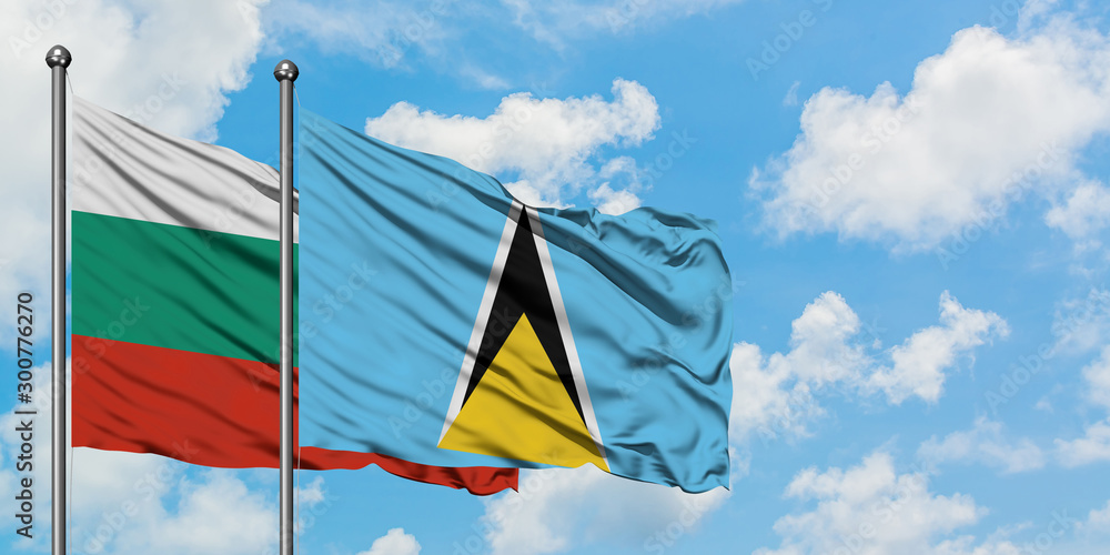 Bulgaria and Saint Lucia flag waving in the wind against white cloudy blue sky together. Diplomacy concept, international relations.