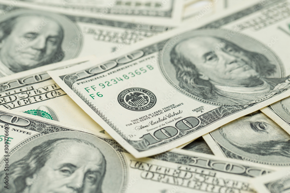 Background of one hundred dollar bills. Benjamin Franklin on USA money banknote Background of one hundred dollar bills. Benjamin Franklin on USA money banknote