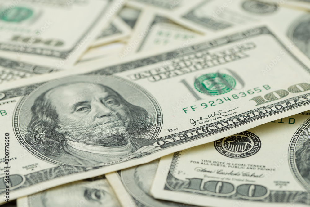 Background of one hundred dollar bills. Benjamin Franklin on USA money banknote Background of one hundred dollar bills. Benjamin Franklin on USA money banknote