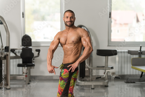 Serious Bodybuilder Standing In The Gym © Jale Ibrak