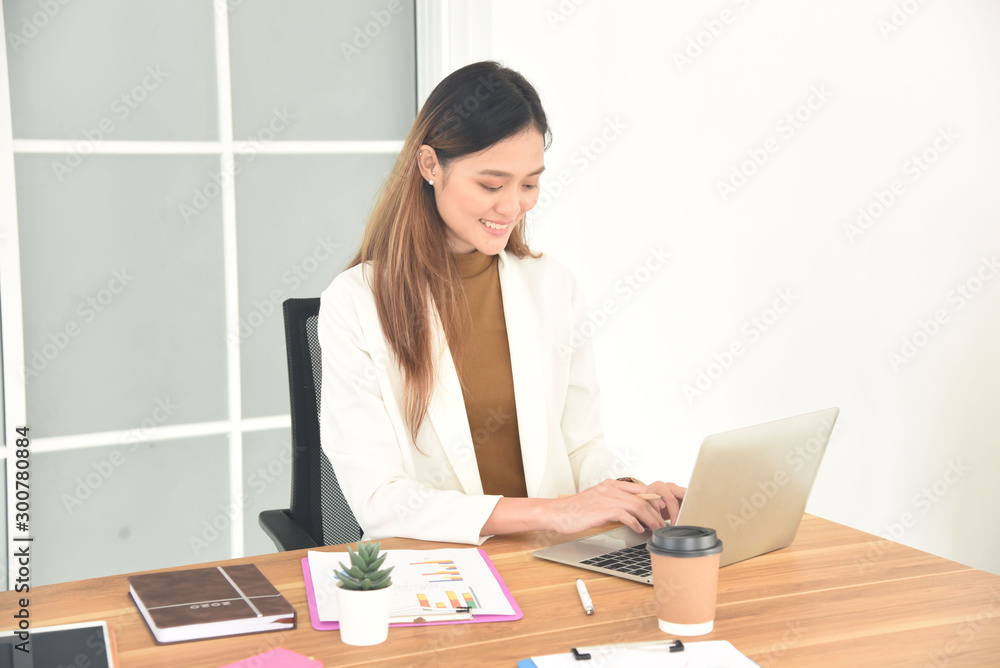 business woman working on laptop in office business woman working on laptop in office