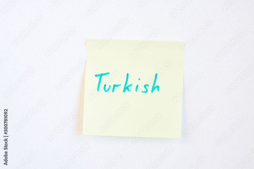Top view flat lay of turkish language which written on the reminder notepaper of different colors. Top view flat lay of turkish language which written on the reminder notepaper of different colors.