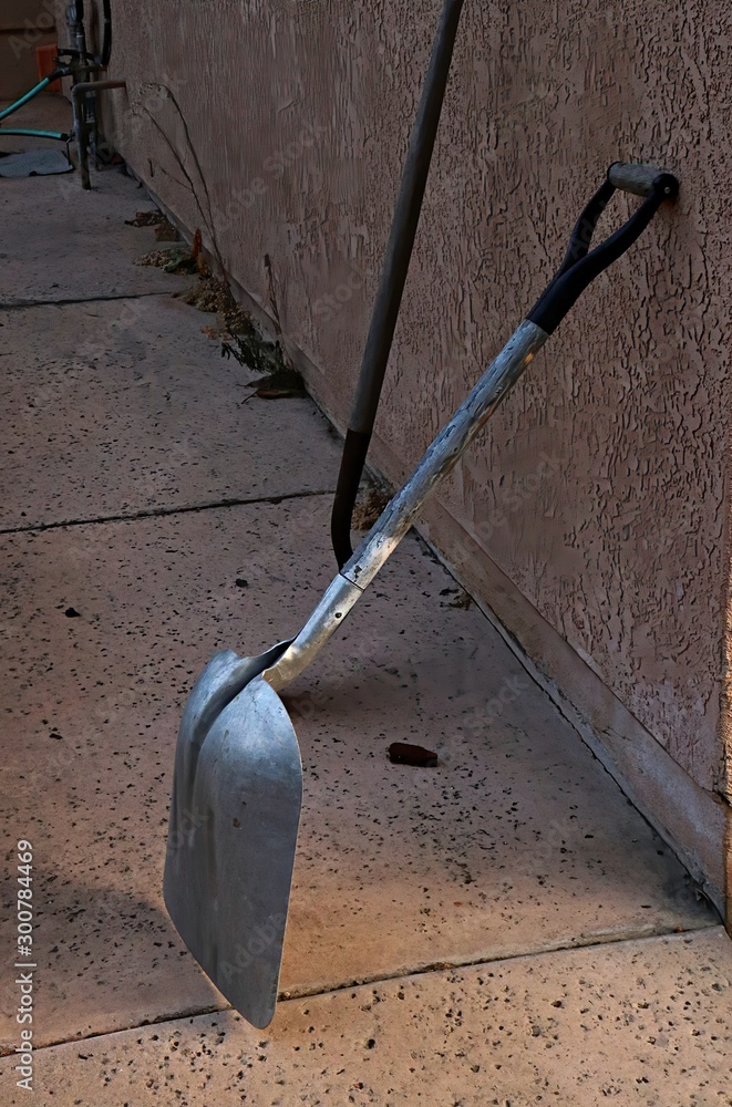 Tools propped against a wall ready for the next task Tools propped against a wall ready for the next task