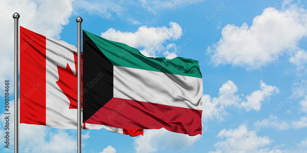 Canada and Kuwait flag waving in the wind against white cloudy blue sky together. Diplomacy concept, international relations. Canada and Kuwait flag waving in the wind against white cloudy blue sky together. Diplomacy concept, international relations.