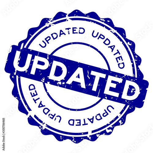 Grunge blue updated word round rubber seal buiness stamp on white background