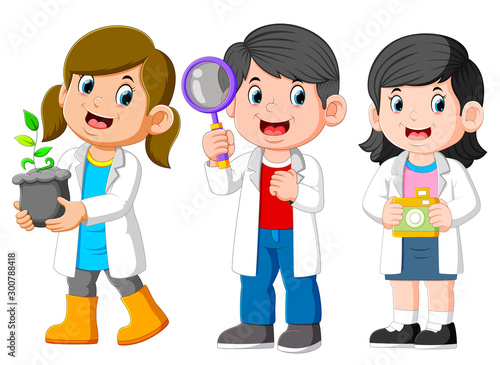 Three Kids Scientist Wearing White Laboratory Gown and Holding a Seedling, Magnifying Glass, Camera