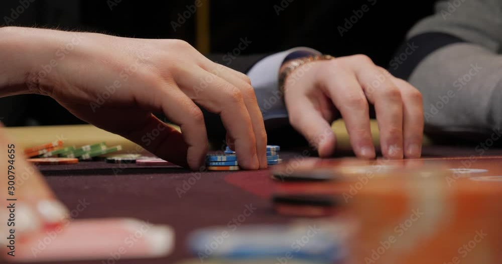 Dealer poker player with chips at casino table Dealer poker player with chips at casino table