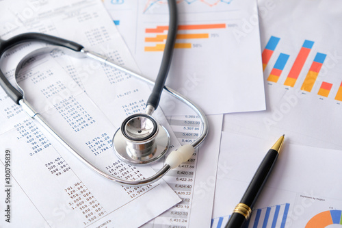 Stethoscope with Pen, Charts and Graphs, Finance, Account, Statistics, Investment, Analytic Research Data Economy Spreadsheet and Business Company Concept